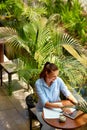 Business Woman Working On Computer At Cafe Outdoors. Freelance Work Royalty Free Stock Photo