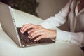 Business woman working with computer in office. Side view of female hands typing keyboard. Close up shot. High quality Royalty Free Stock Photo