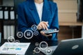 Business woman working on desk office with using a calculator to calculate the numbers, finance concept in office Royalty Free Stock Photo