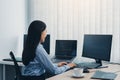 Business woman working on desktop computer monitor professional and sitting at her office desk and working on new software program Royalty Free Stock Photo