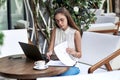 business woman is working with documents at a table in a cafe. Royalty Free Stock Photo