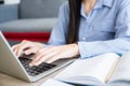 Business woman working from home by computer laptop. Close up and focus to keyboard and her hand Royalty Free Stock Photo