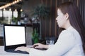 Business woman working at home and typing keyboard with white screen laptop. Work from home concept Royalty Free Stock Photo