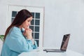 Business woman working on laptop at desk from office online finance