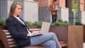 Business Woman Working on Laptop while Sitting Outside Office Royalty Free Stock Photo