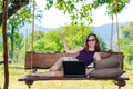 Business woman working on laptop on vacation, free space. Royalty Free Stock Photo