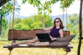 Business woman working on laptop on vacation, free space. Royalty Free Stock Photo