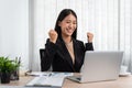 Business woman is working about new business project on laptop and raised your hands when finished work Royalty Free Stock Photo