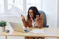 Business woman working in office at desk with laptop, anger and argument, discussing business processes online via video Royalty Free Stock Photo