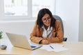 Business woman working in office at desk with laptop, anger and argument, discussing business processes online via video Royalty Free Stock Photo