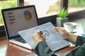 Business woman uBusiness woman working at office with laptop, tablet and graph data documents on his desk, Analyze strategy Royalty Free Stock Photo