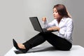 Business woman working sitting on the floor write with laptop