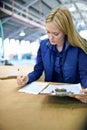 Business woman, writing and checking inventory with clipboard, storage or supply chain at warehouse. Female person, job Royalty Free Stock Photo