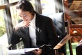 Business woman writing on clipboard outside on terrace. Royalty Free Stock Photo