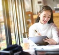 Business woman writing on clipboard outside on terrace. Royalty Free Stock Photo