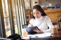 Business woman writing on clipboard outside on terrace. Royalty Free Stock Photo