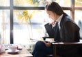 Business woman writing on clipboard outside on terrace.next to t Royalty Free Stock Photo