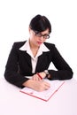 Business woman writing at her desk Royalty Free Stock Photo