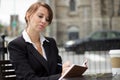 Business woman writing in her journal