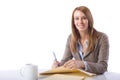 Business Woman Writing notes at desk Royalty Free Stock Photo