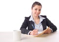 Business Woman Writing notes at desk Royalty Free Stock Photo