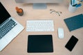 Business woman writing notes working on her office. Morning at a creative studio. Graphic design, mock up screens. glasses, pens,