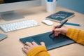 Business woman writing notes working on her office. Morning at a creative studio. Graphic design, mock up screens. glasses, pens,