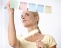 Business woman, writing and schedule planning on sticky notes or glass board for project or time management. Creative Royalty Free Stock Photo