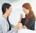 Business women, coffee and laughing with gossip, funny story or conversation with partner in office. Work friends, happy Royalty Free Stock Photo