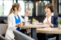 Business women during a coffee time in the cafe Royalty Free Stock Photo