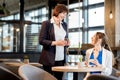 Business women during a coffee time in the cafe Royalty Free Stock Photo