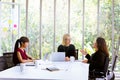 Business women discussing at table in office Royalty Free Stock Photo
