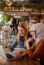 Business. Women Meeting In Cafe. Diversity Ethnic Colleagues. Blonde Showing Something At Laptop Screen. Royalty Free Stock Photo