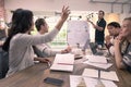 Business woman raise hand for ask question to businessman who is standing and explaining chart in front of meeting room, concept f Royalty Free Stock Photo