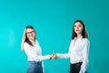 Business woman shaking hands, concept close deal or partnership. Two women partners handshaking after signing business contract. Royalty Free Stock Photo