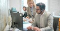 Business woman showing document to her male colleague at the office. Royalty Free Stock Photo