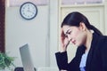 Business women sit and strain the computer screen for a long time. Because the work has been overloaded.