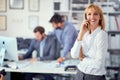 Business woman - Business woman using mobile phone in office Royalty Free Stock Photo