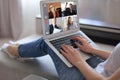 Business woman talking to her colleagues in video conference. Business team working from home using laptop Royalty Free Stock Photo