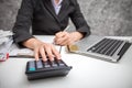 Business women using calculator at working with financial reports Royalty Free Stock Photo