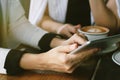 Business women using tablet pc in coffee cafe for discuss project. Royalty Free Stock Photo