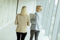 Business women walking in the office corridor Royalty Free Stock Photo