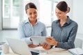 Business women working together on a tablet Royalty Free Stock Photo