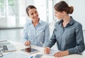 Business women working together on a tablet Royalty Free Stock Photo