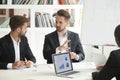 Business worker sharing thoughts with male coworker Royalty Free Stock Photo