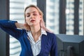 Business worker feeling tired frustrated stressed from hard work and massage necks to relieve pain and tension from office