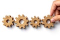 Business workflow automation, hand with wooden cog, process flowchart, isolated on white