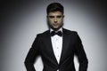 Business young attractive guy in tuxedo standing