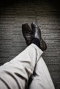 Business young man relaxing chilling with legs crossed on carpet Royalty Free Stock Photo