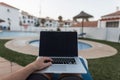 Business young man on rest with laptop. Successful designer guy working on a creative project on a laptop and relaxes Royalty Free Stock Photo